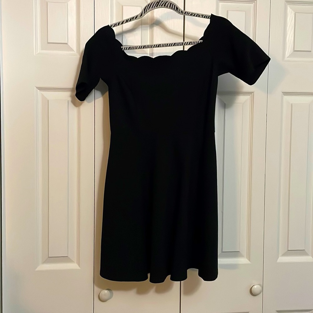Black dress with beautiful scalloped neckline.